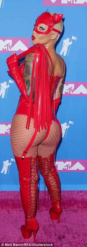 Amber-Rose-flaunts-her-hourglass-figure-in-a-devil-costume-for-MTV-VMAs-red-carpet...-as-star-arrives-in-bodysuit-with-face-mask-and-whip-6.jpg