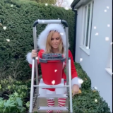 Amanda-Holden-Cleaning-Windows-In-Santa-Uniform-1.png