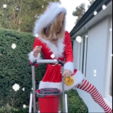 Amanda-Holden-Cleaning-Windows-In-Santa-Uniform-2