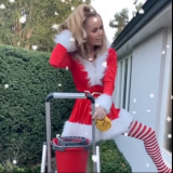 Amanda-Holden-Cleaning-Windows-In-Santa-Uniform-3.png