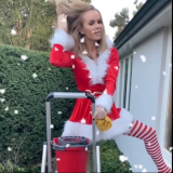 Amanda-Holden-Cleaning-Windows-In-Santa-Uniform-4