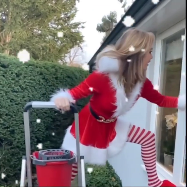 Amanda Holden Cleaning Windows In Santa Uniform (5)